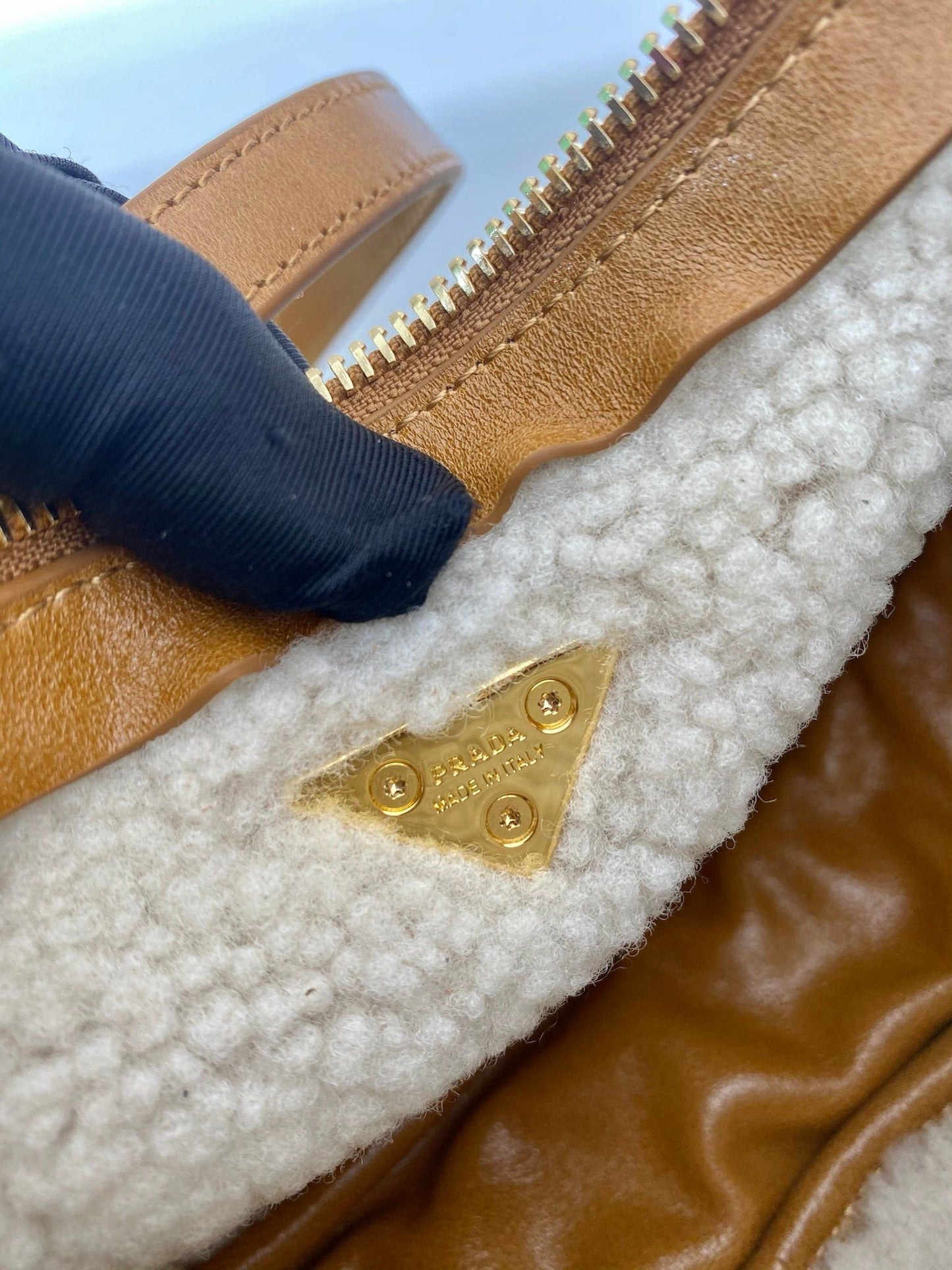 Prada Arqué small shearling shoulder bag