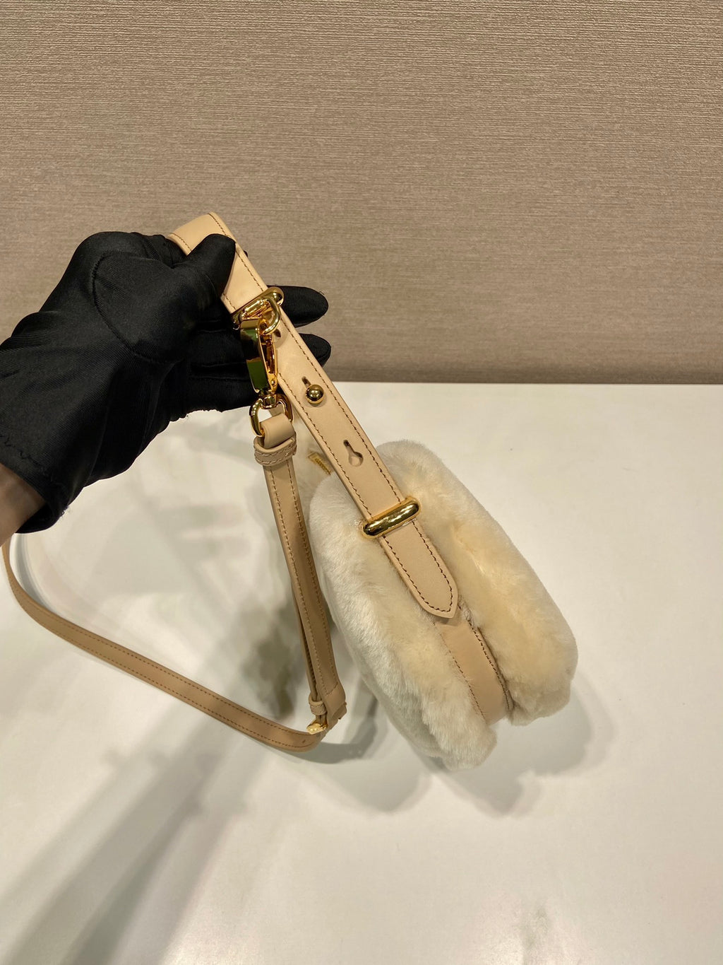 Prada Arqué shearling and leather shoulder bag