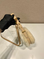 Prada Arqué shearling and leather shoulder bag