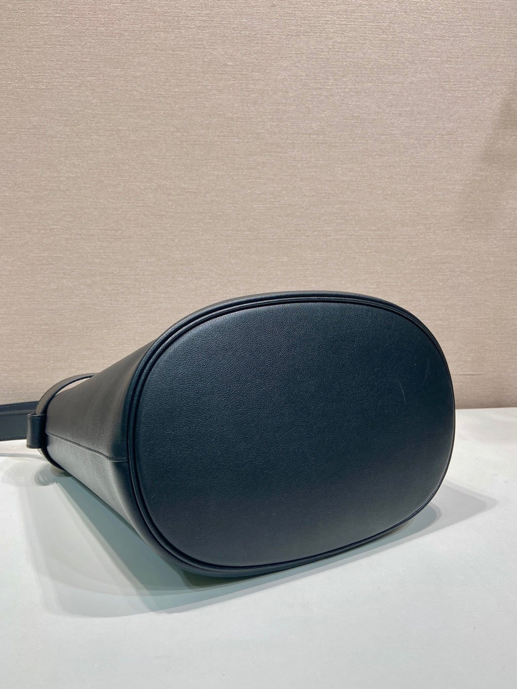 Prada Buckle leather bucket bag with belt