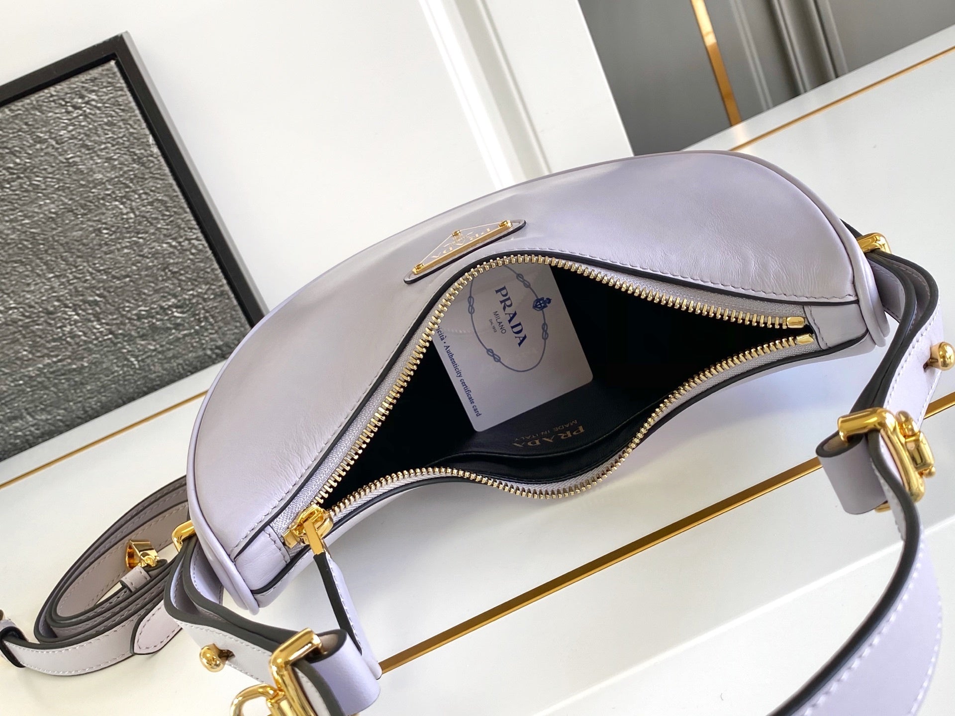 Prada Arqué small leather shoulder bag