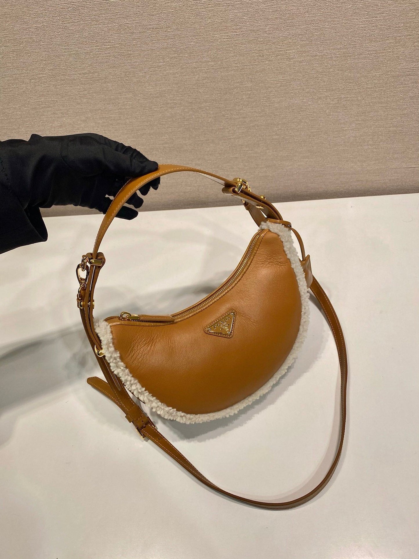 Prada Arqué small shearling shoulder bag