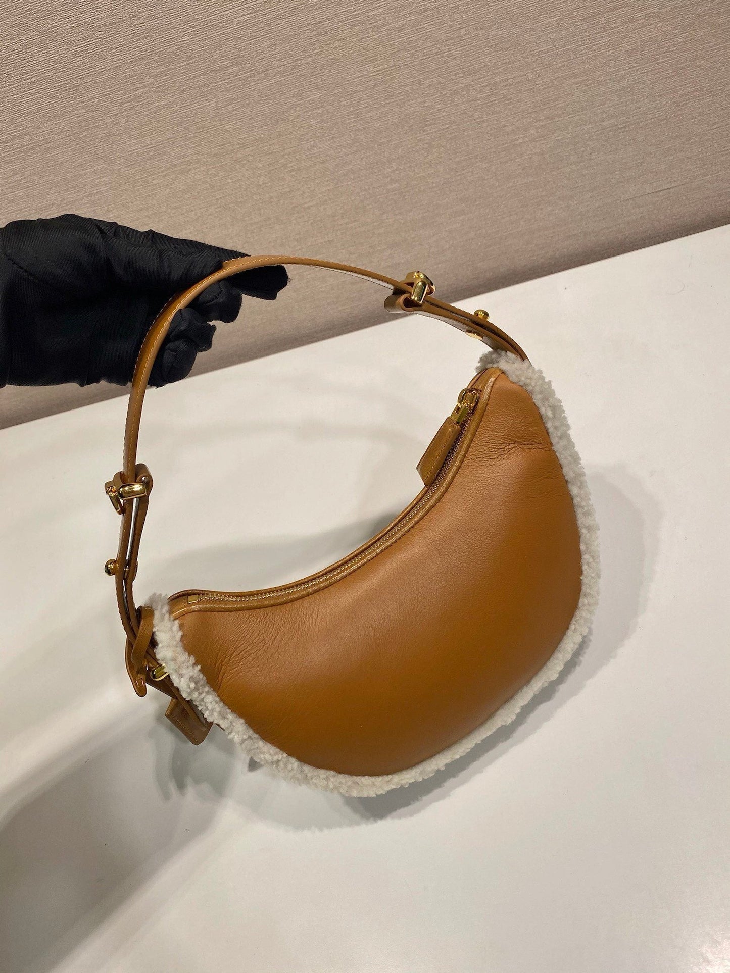 Prada Arqué small shearling shoulder bag