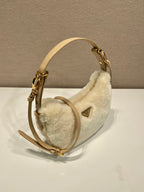 Prada Arqué shearling and leather shoulder bag