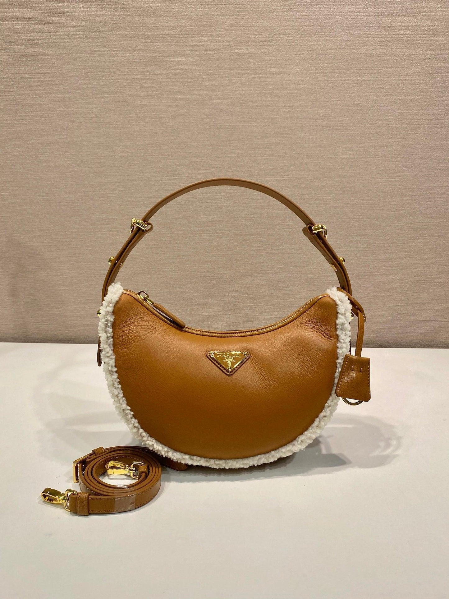 Prada Arqué small shearling shoulder bag
