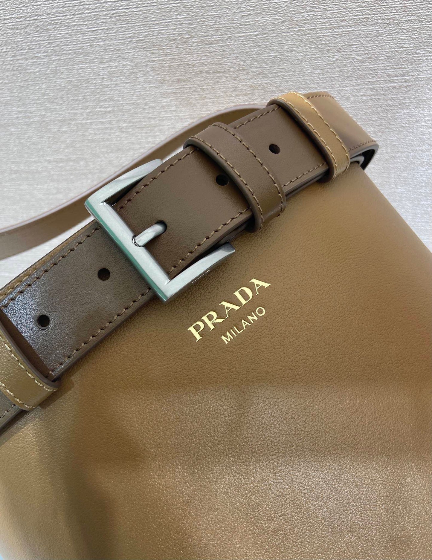 Prada Buckle leather bucket bag with belt