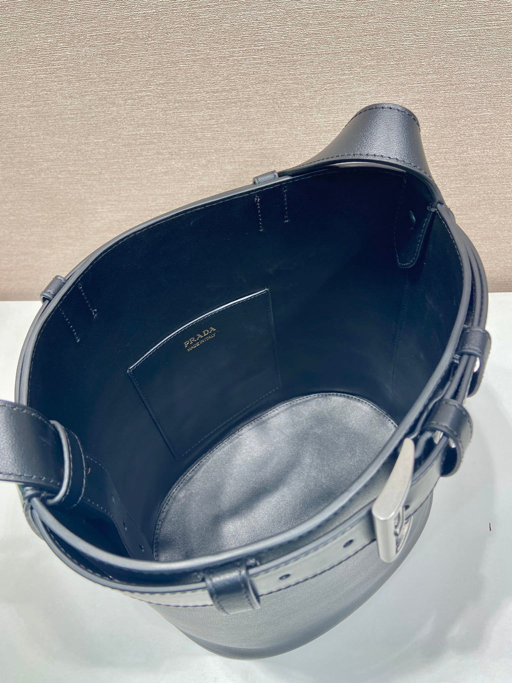 Prada Buckle leather bucket bag with belt