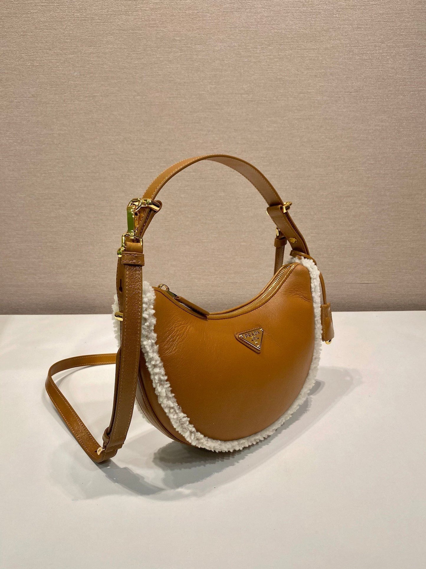 Prada Arqué small shearling shoulder bag