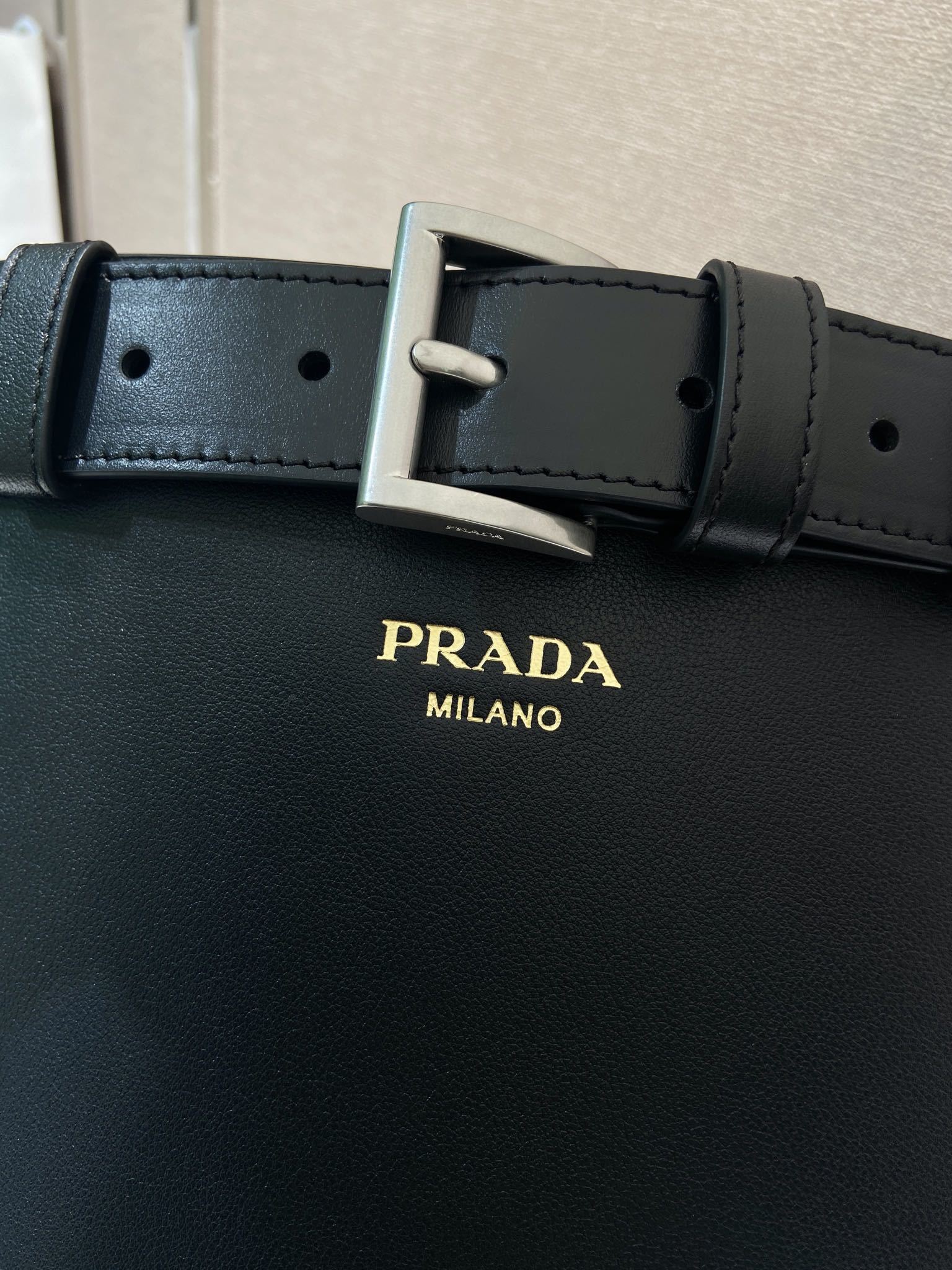 Prada Buckle leather bucket bag with belt