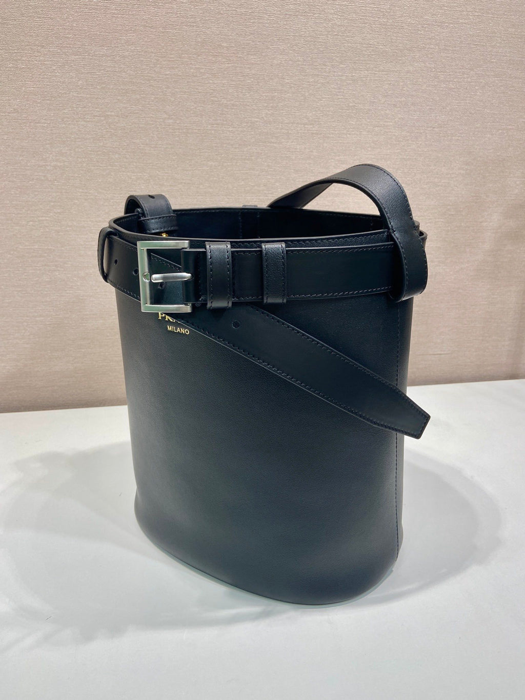 Prada Buckle leather bucket bag with belt