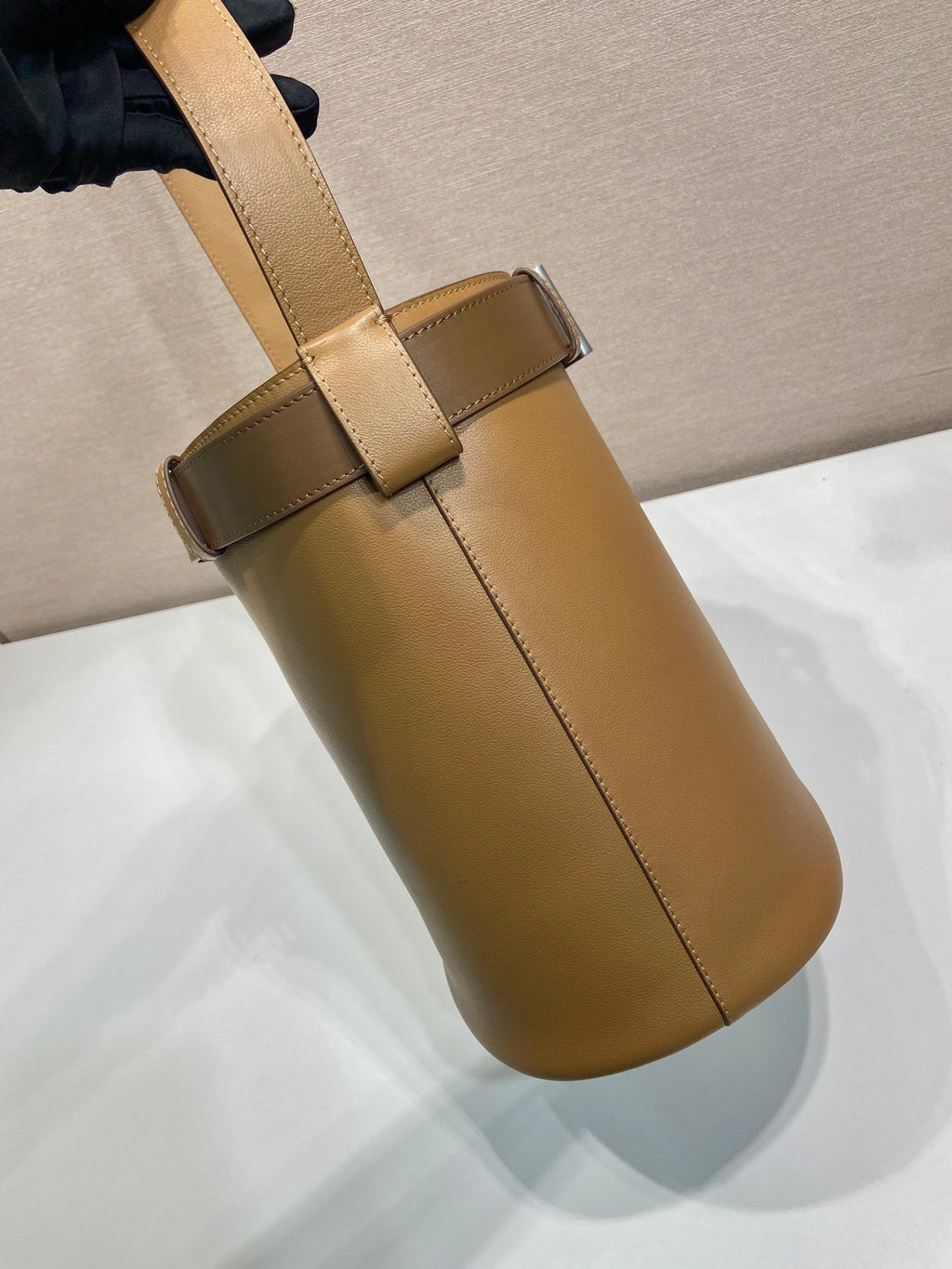 Prada Buckle leather bucket bag with belt