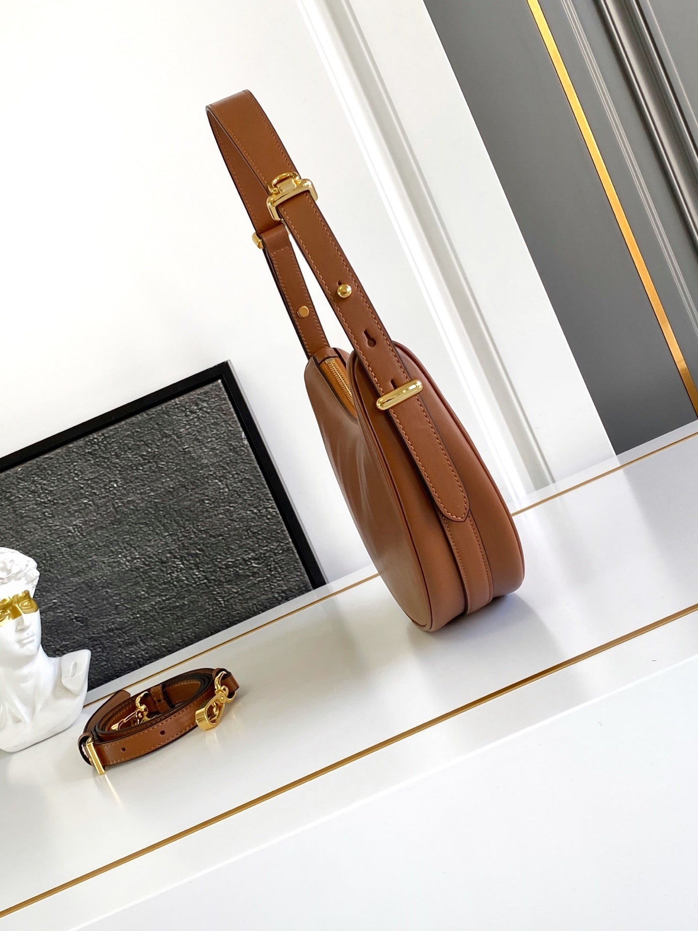 Prada Arqué small leather shoulder bag