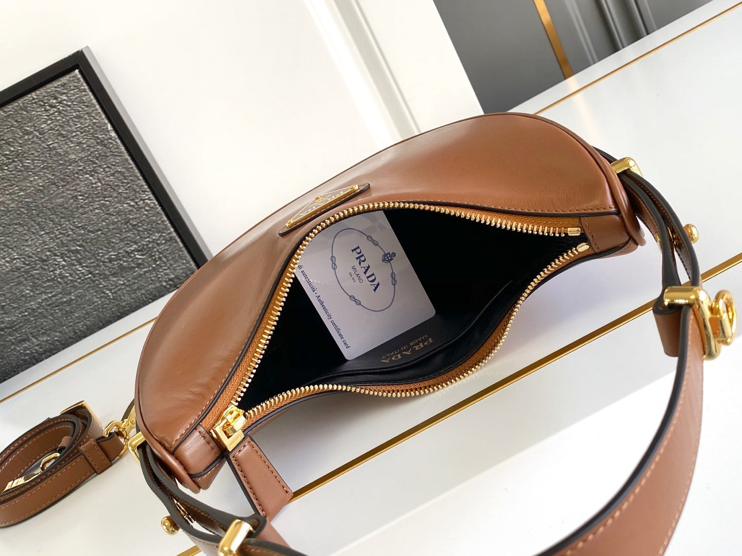 Prada Arqué small leather shoulder bag