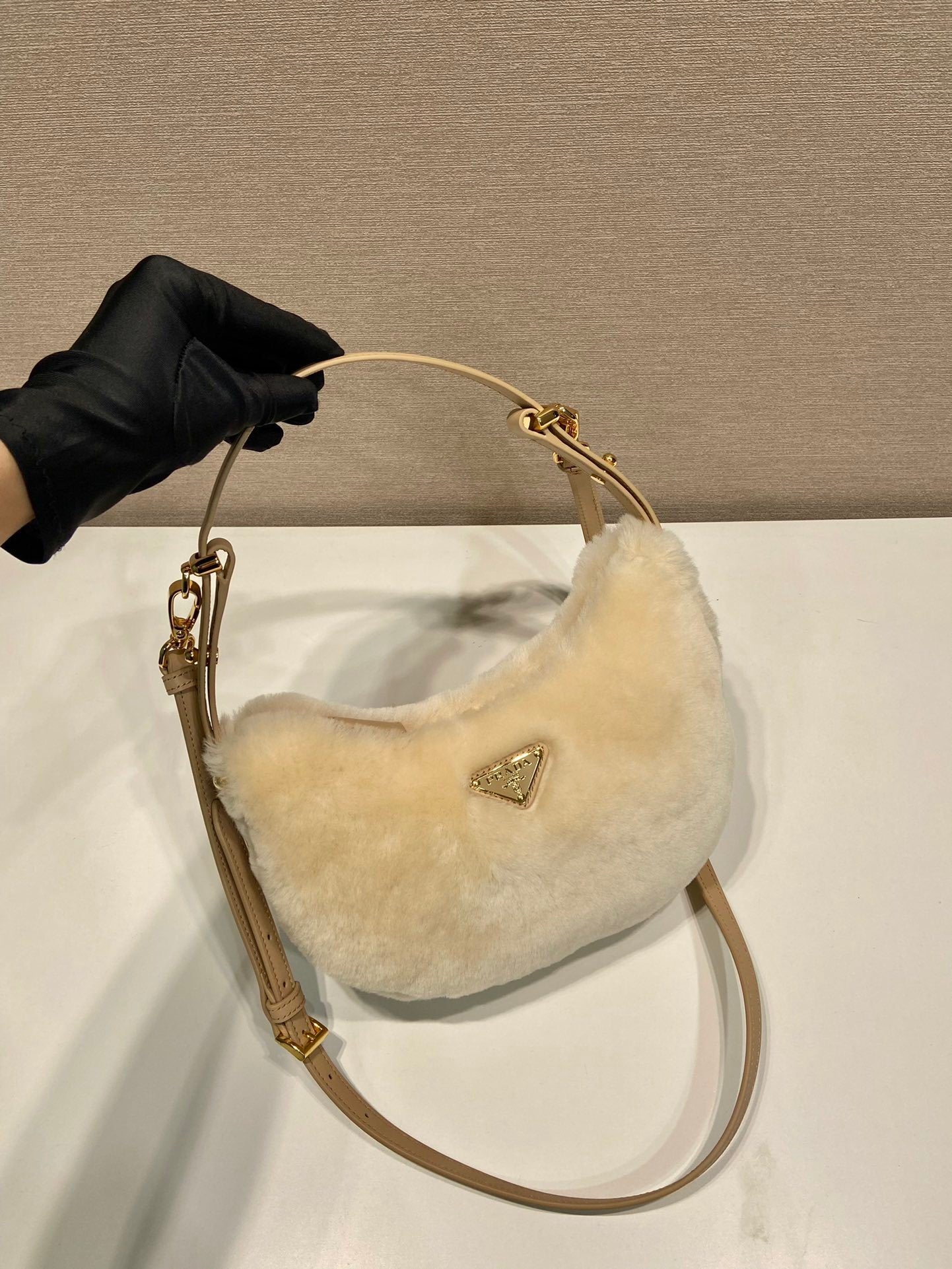 Prada Arqué shearling and leather shoulder bag