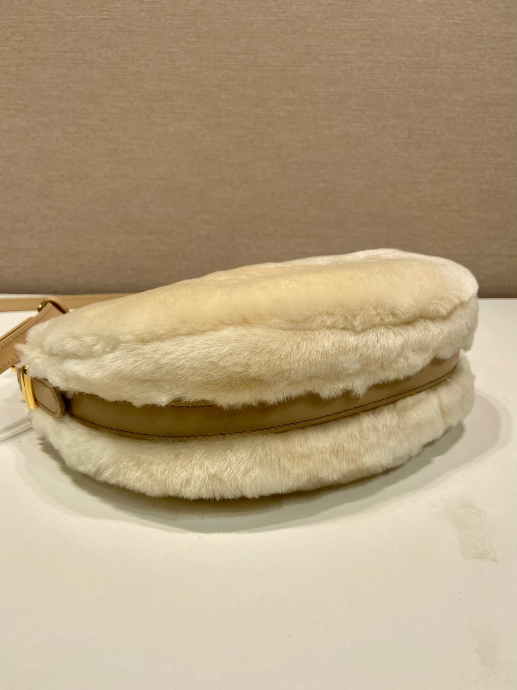 Prada Arqué shearling and leather shoulder bag