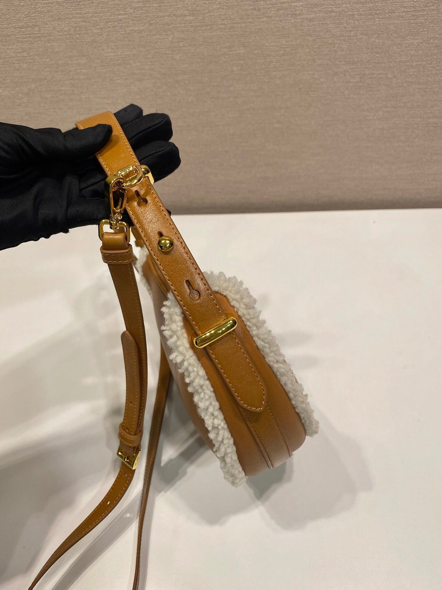 Prada Arqué small shearling shoulder bag