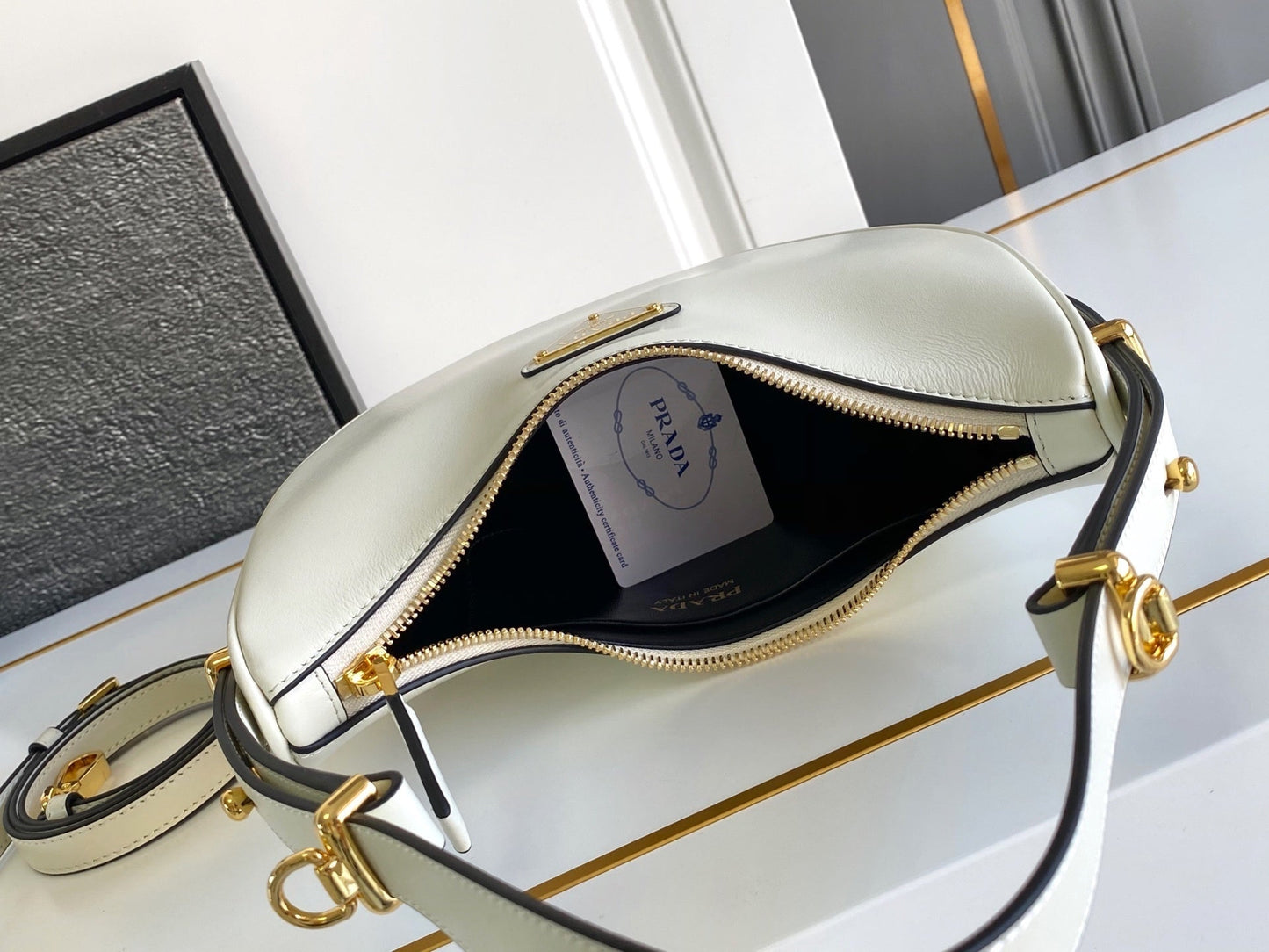Prada Arqué small leather shoulder bag