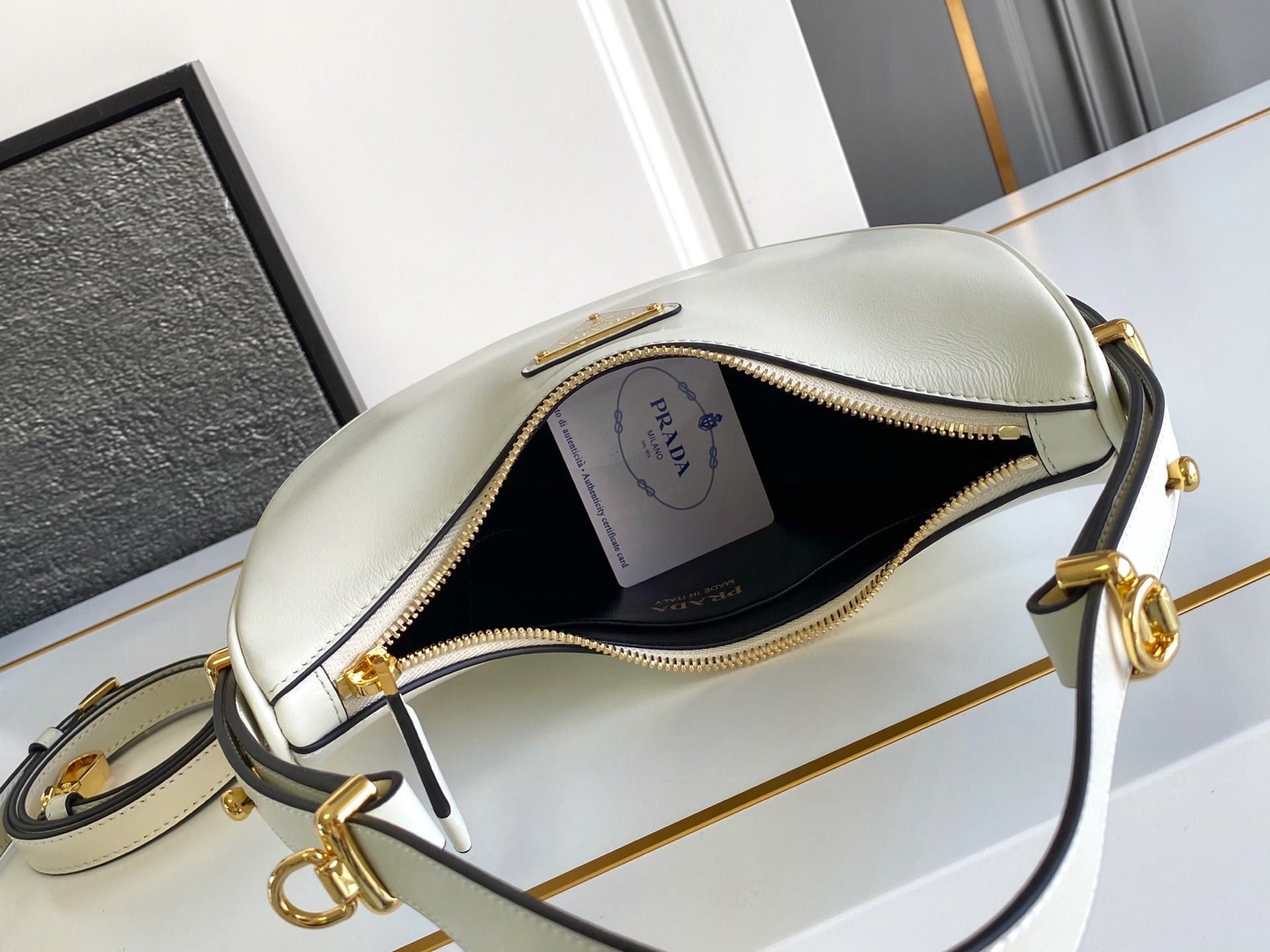 Prada Arqué small leather shoulder bag