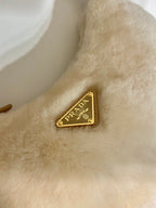 Prada Arqué shearling and leather shoulder bag