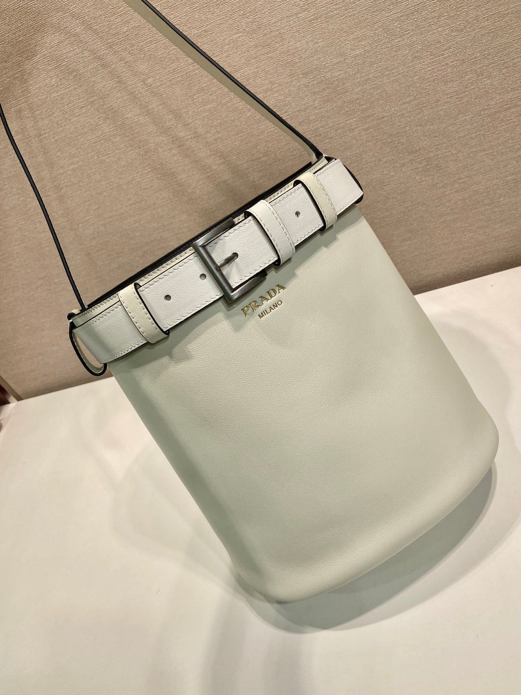 Prada Buckle leather bucket bag with belt