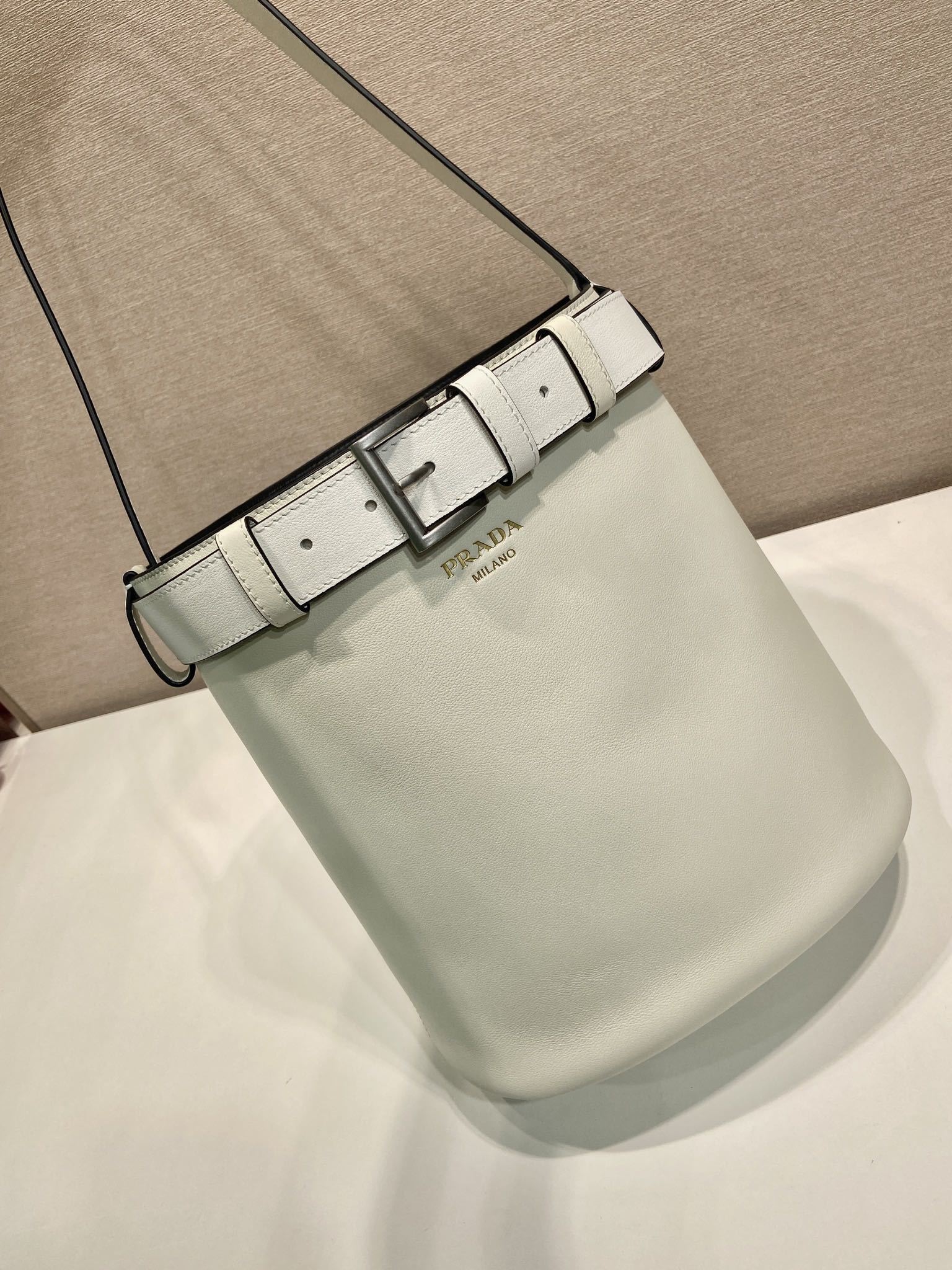 Prada Buckle leather bucket bag with belt