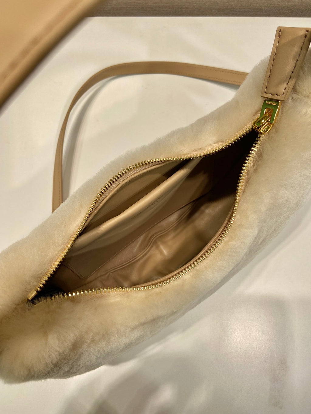 Prada Arqué shearling and leather shoulder bag