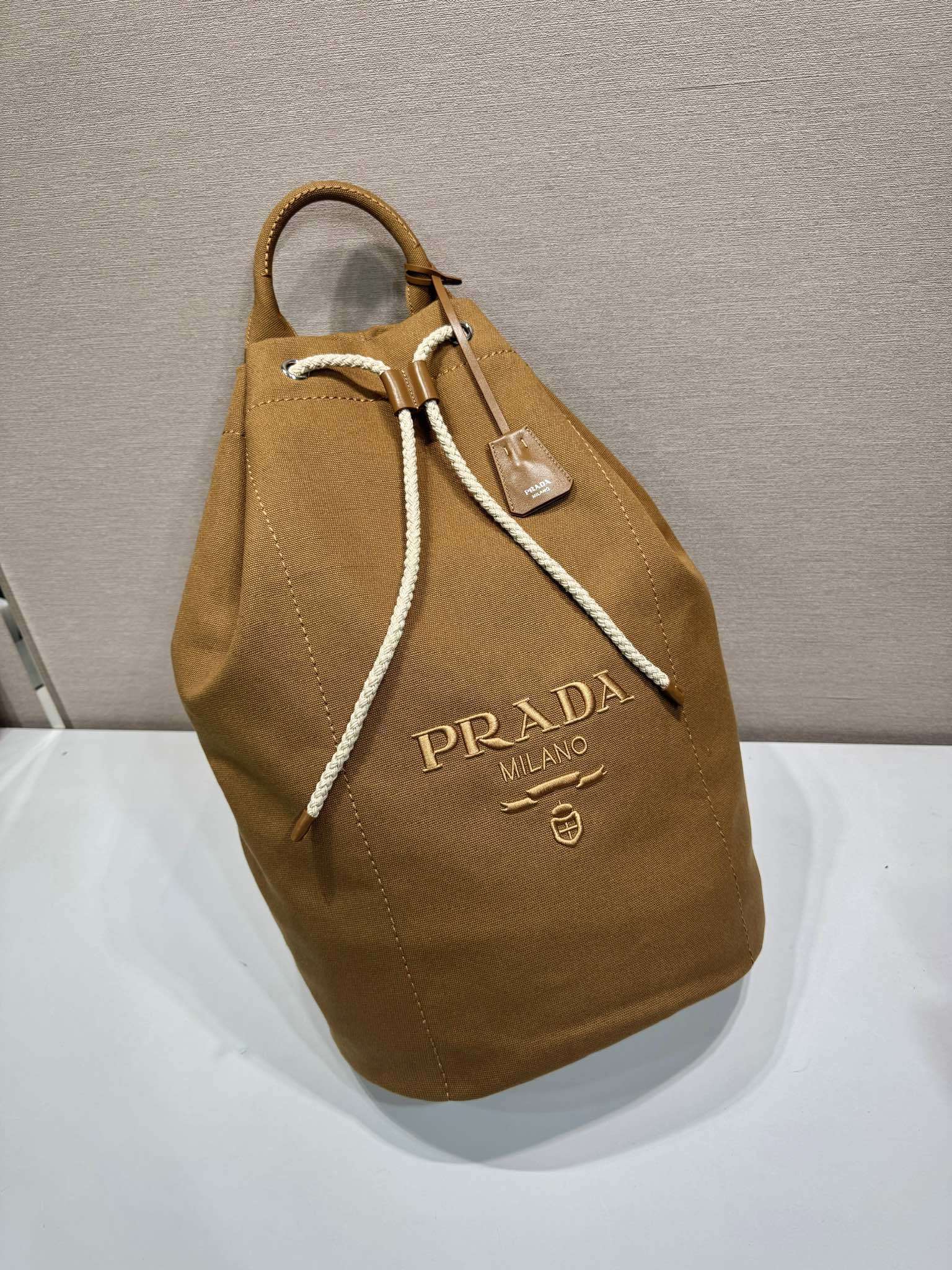 Prada canvas drawstring duffle bag
