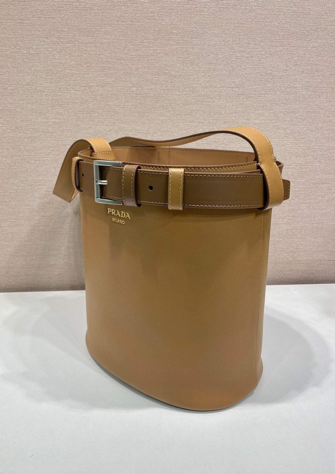 Prada Buckle leather bucket bag with belt