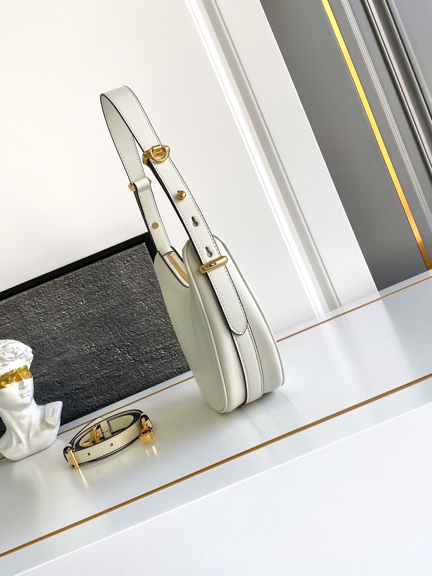 Prada Arqué small leather shoulder bag