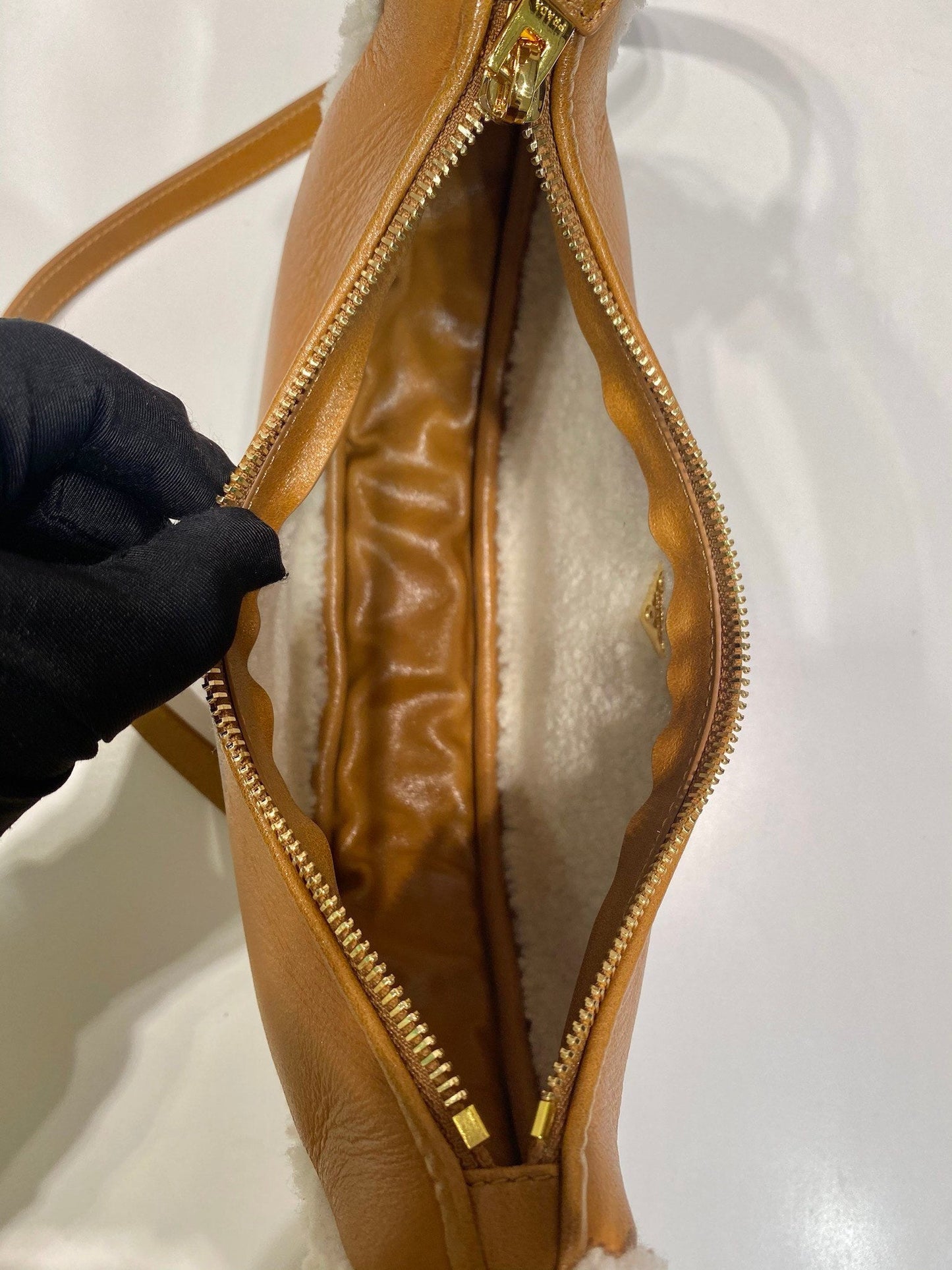 Prada Arqué small shearling shoulder bag