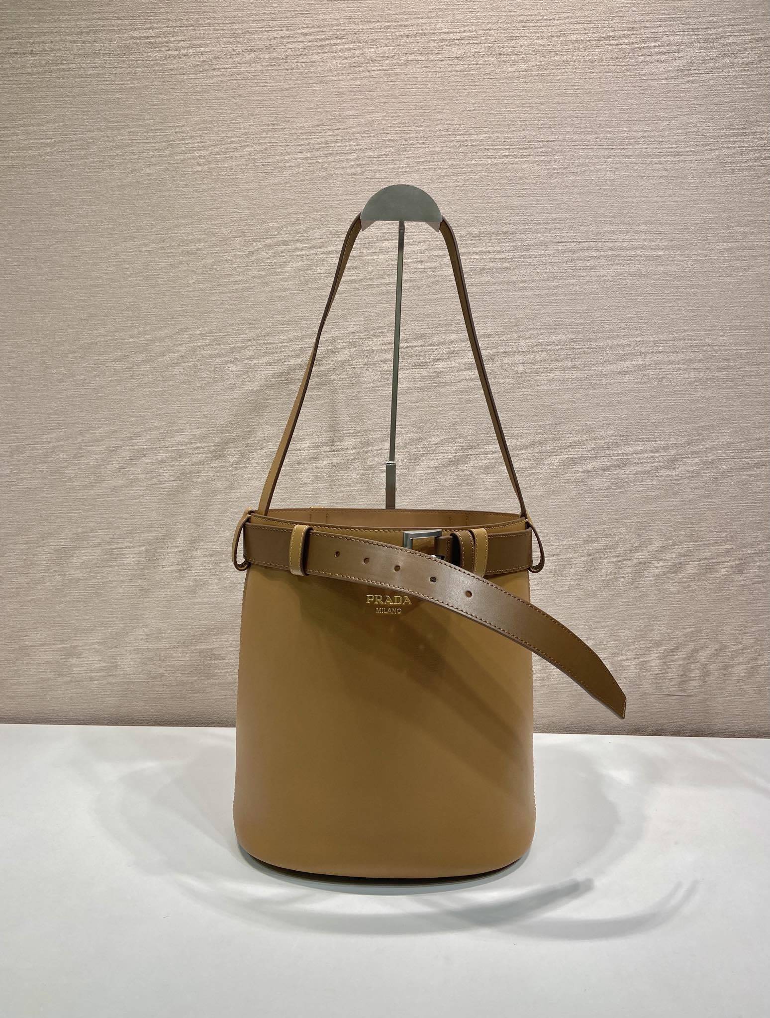 Prada Buckle leather bucket bag with belt