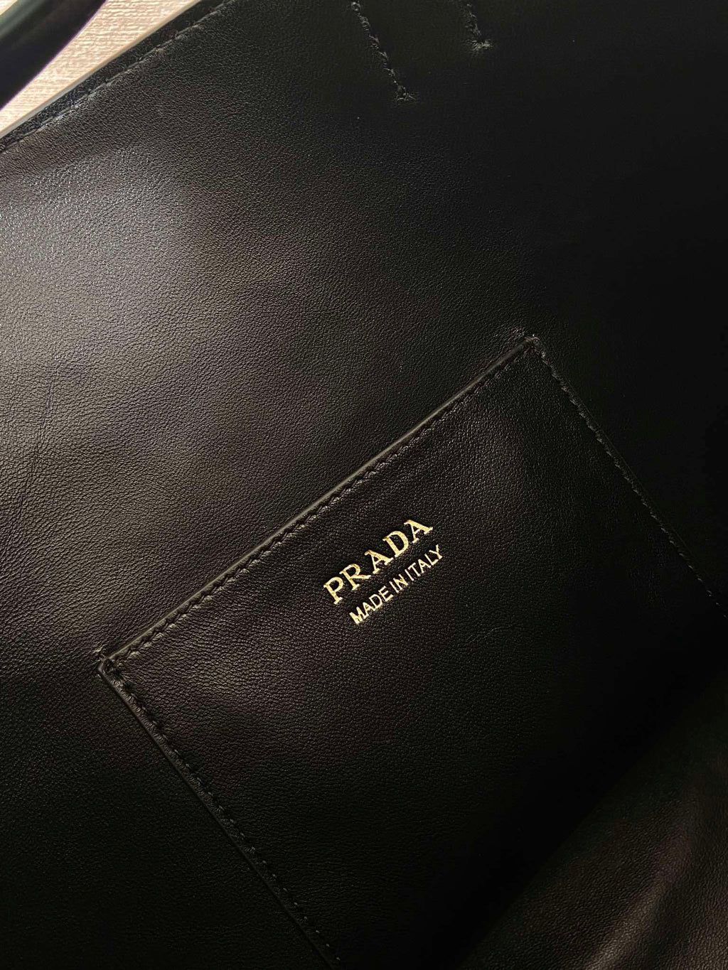 Prada Buckle leather bucket bag with belt