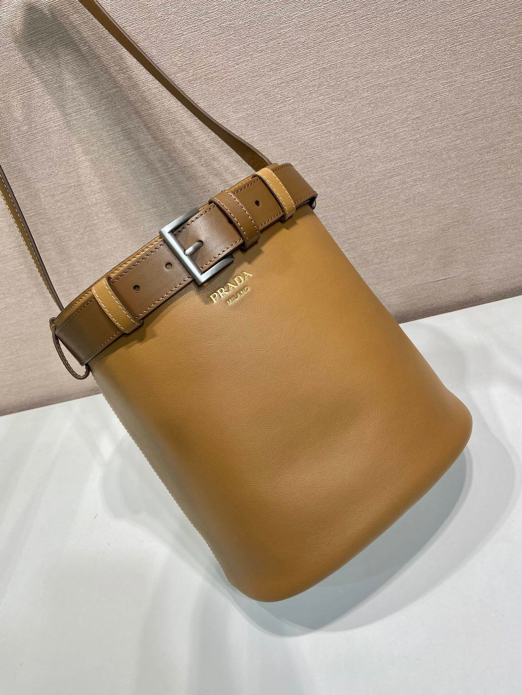 Prada Buckle leather bucket bag with belt