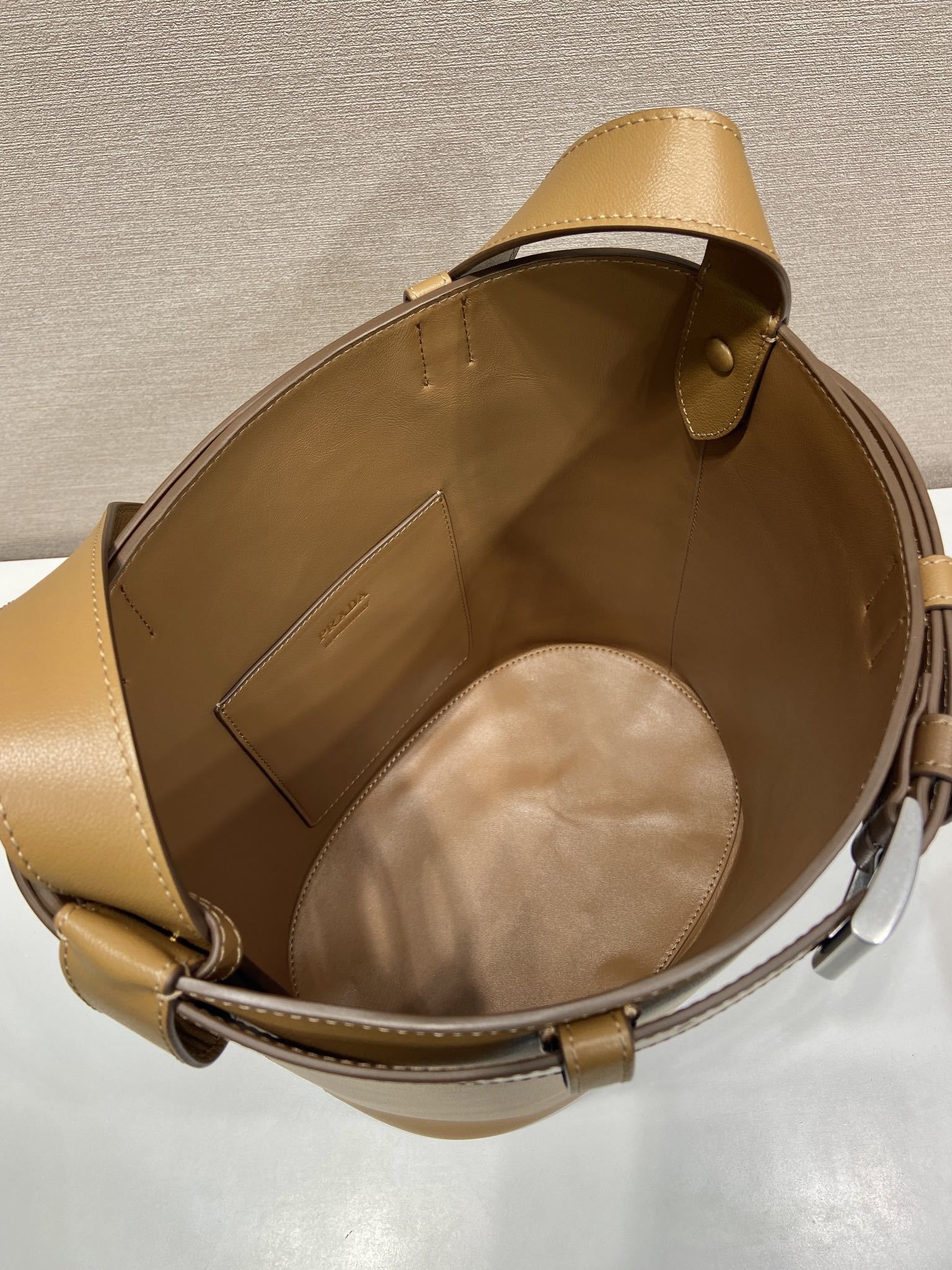 Prada Buckle leather bucket bag with belt