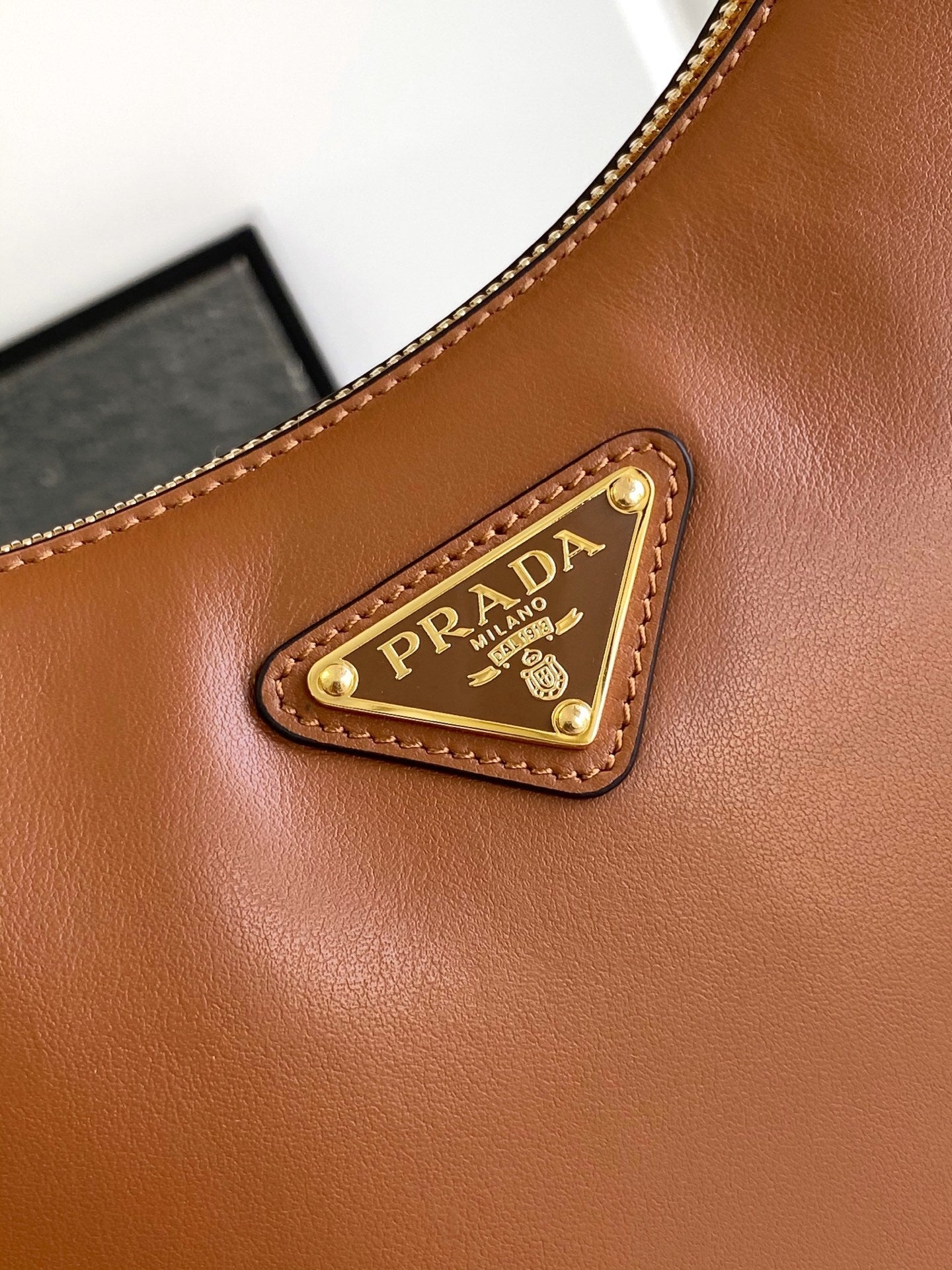 Prada Arqué small leather shoulder bag