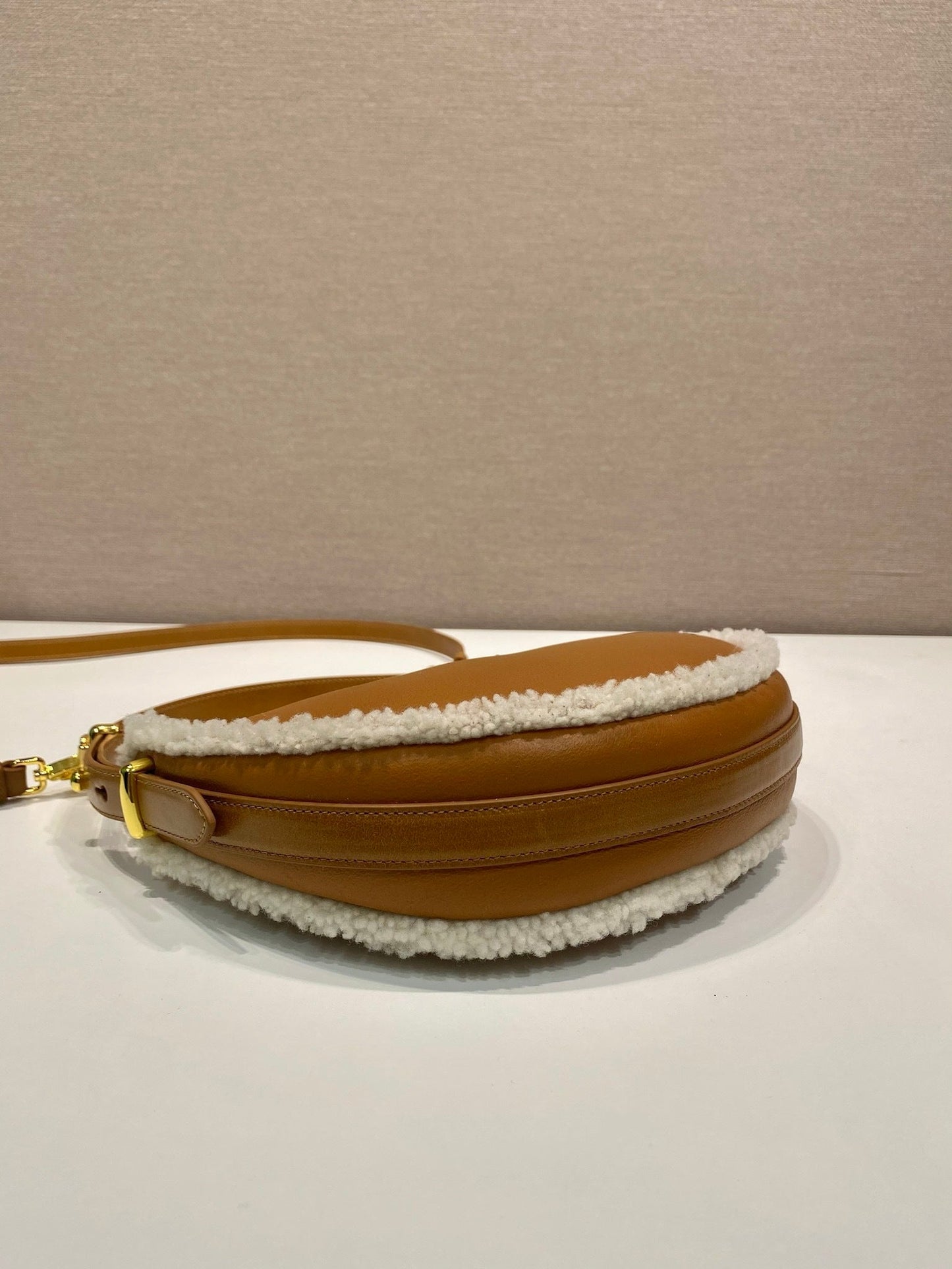 Prada Arqué small shearling shoulder bag