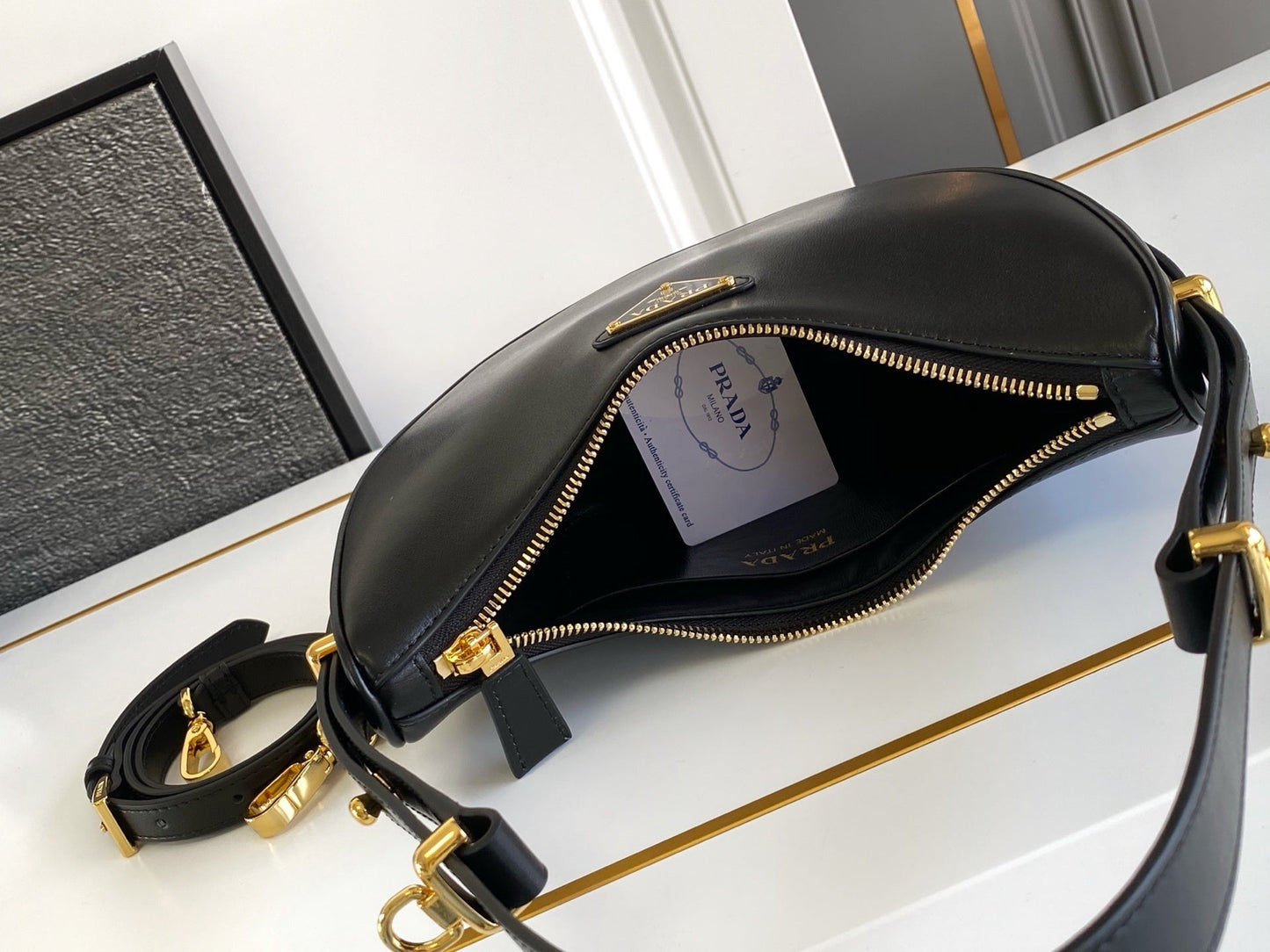 Prada Arqué small leather shoulder bag