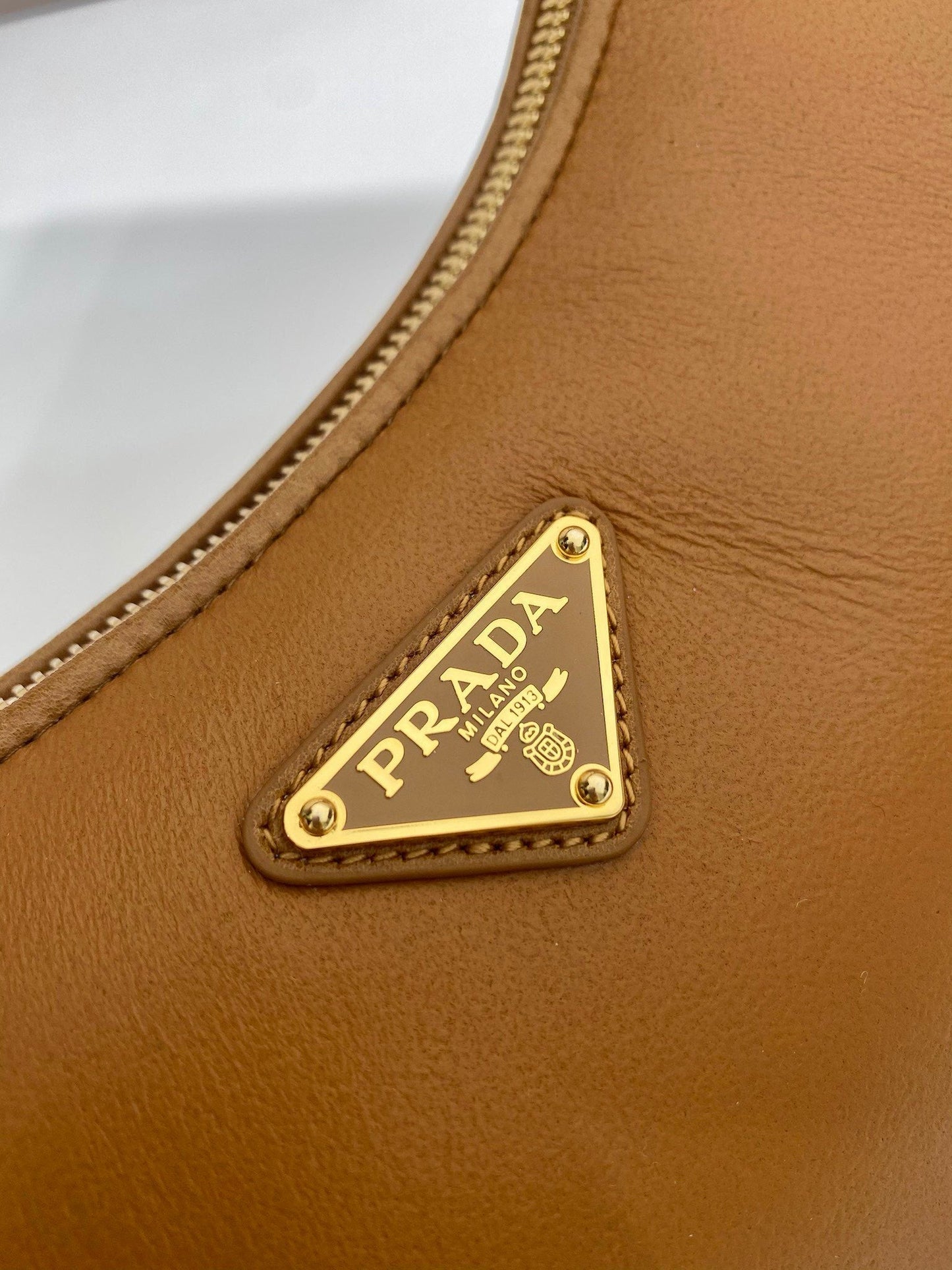 Prada Arqué small shearling shoulder bag
