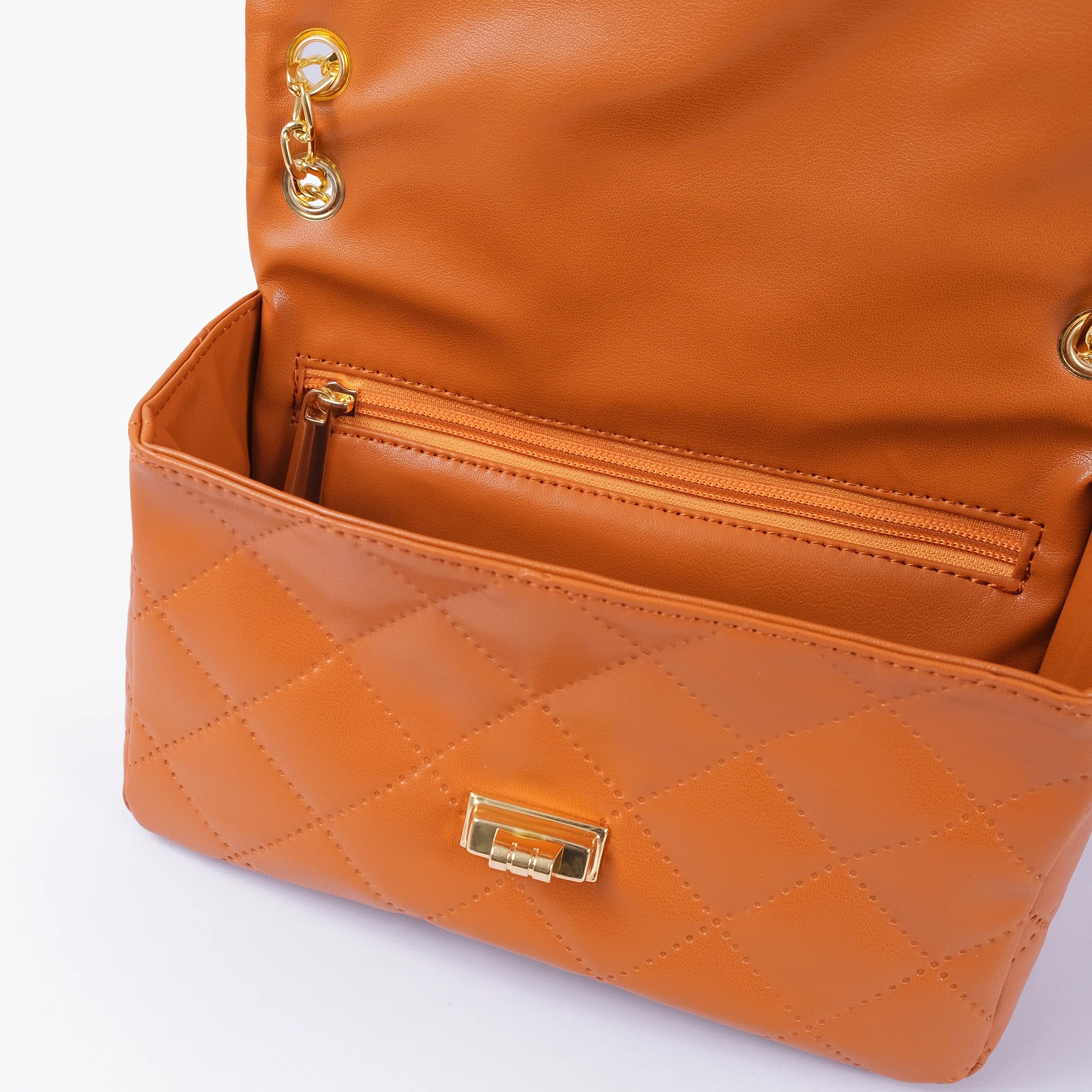 Orange quilted mini bag with chain